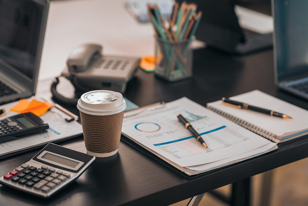 Small business accounting office desk representing all-inclusive IT support with flat monthly pricing and predictable managed IT services